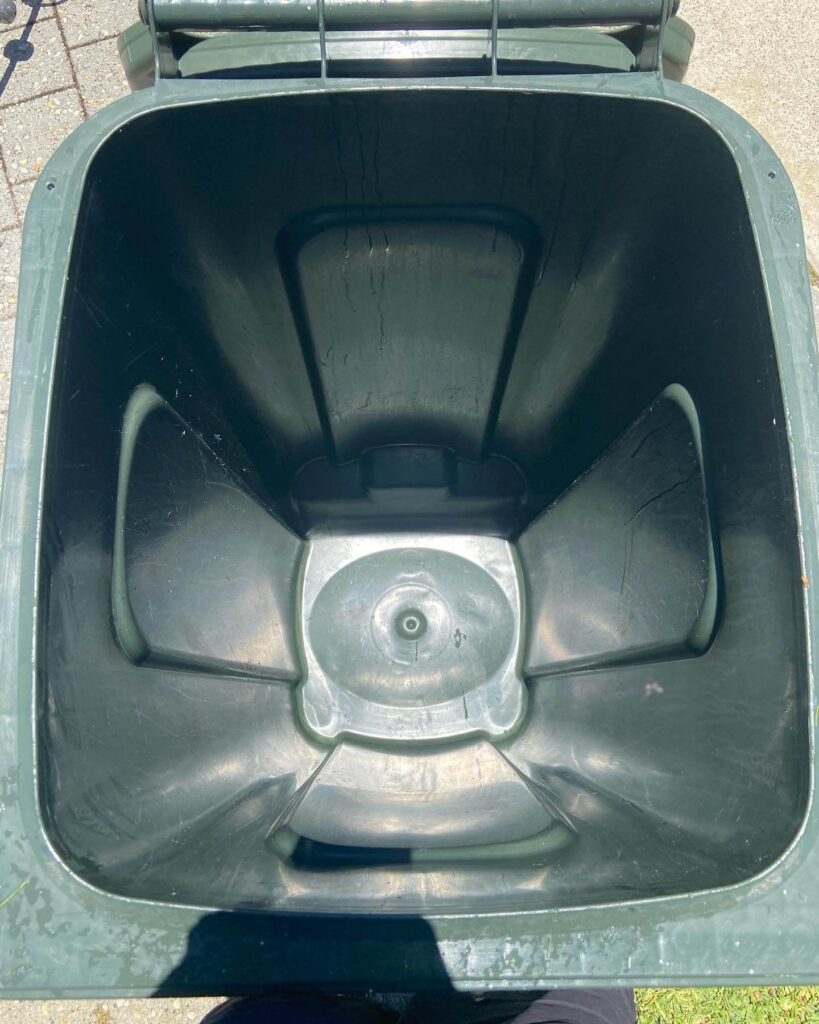 Green colored open dustbin ready to use for trash in Bin Cleaning Perth